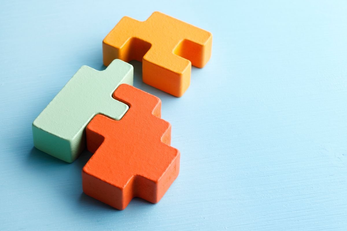 A close up of several modular puzzle pieces. A close up of several modular puzzle pieces.