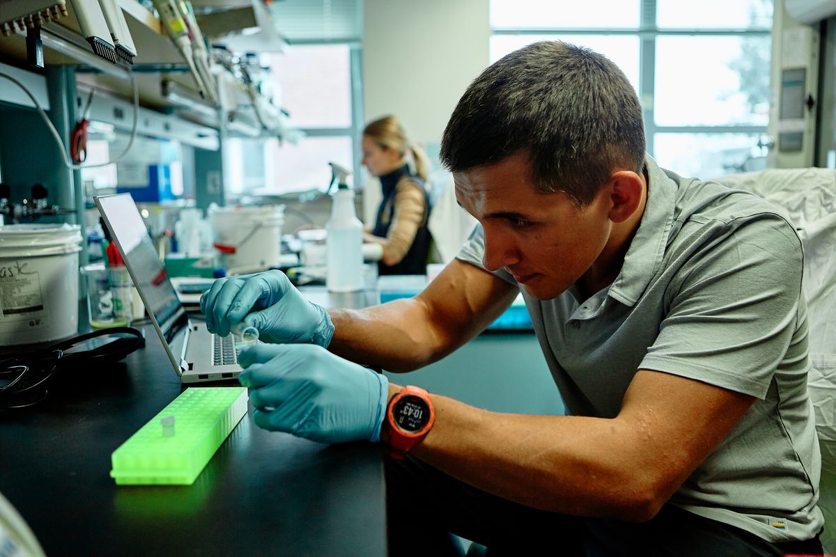 Photo of Nemudryi and Nemudraia working at a lab bench. Photo of Nemudryi and Nemudraia working at a lab bench.