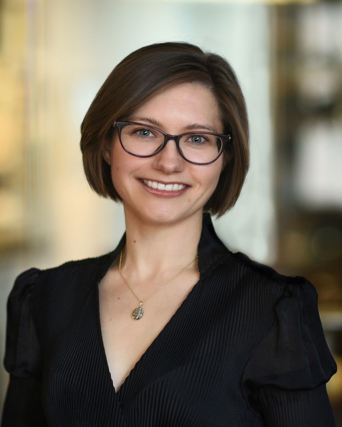 Image of Olga Dudchenko, a molecular geneticist at Baylor College of Medicine, studies how genomes fold in 3D in modern and nonmodern model species. She wears glasses and a black top as she smiles at the camera. Image of Olga Dudchenko, a molecular geneticist at Baylor College of Medicine, studies how genomes fold in 3D in modern and nonmodern model species. She wears glasses and a black top as she smiles at the camera.