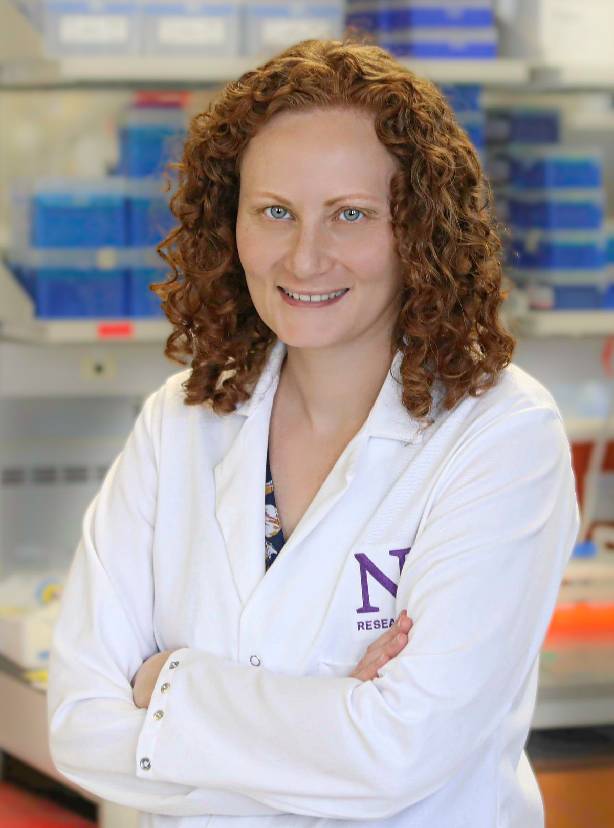 Talia Lerner wears a white lab coat. Talia Lerner wears a white lab coat.